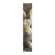 Close-up of a fluffy brown rabbit's face with long ears.