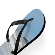 Black flip-flop with light blue footbed showing a snowy mountain landscape.