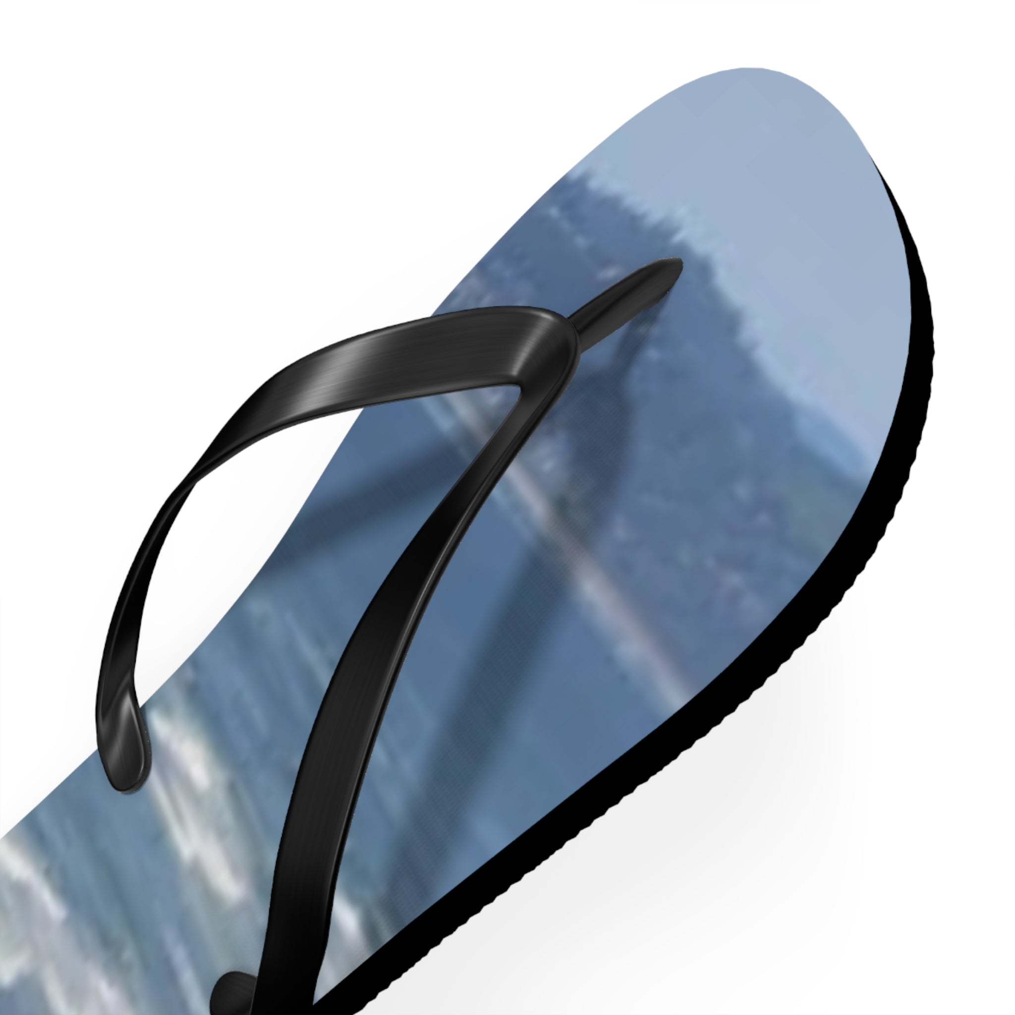 Black flip-flop with a scenic mountain landscape print on the sole.