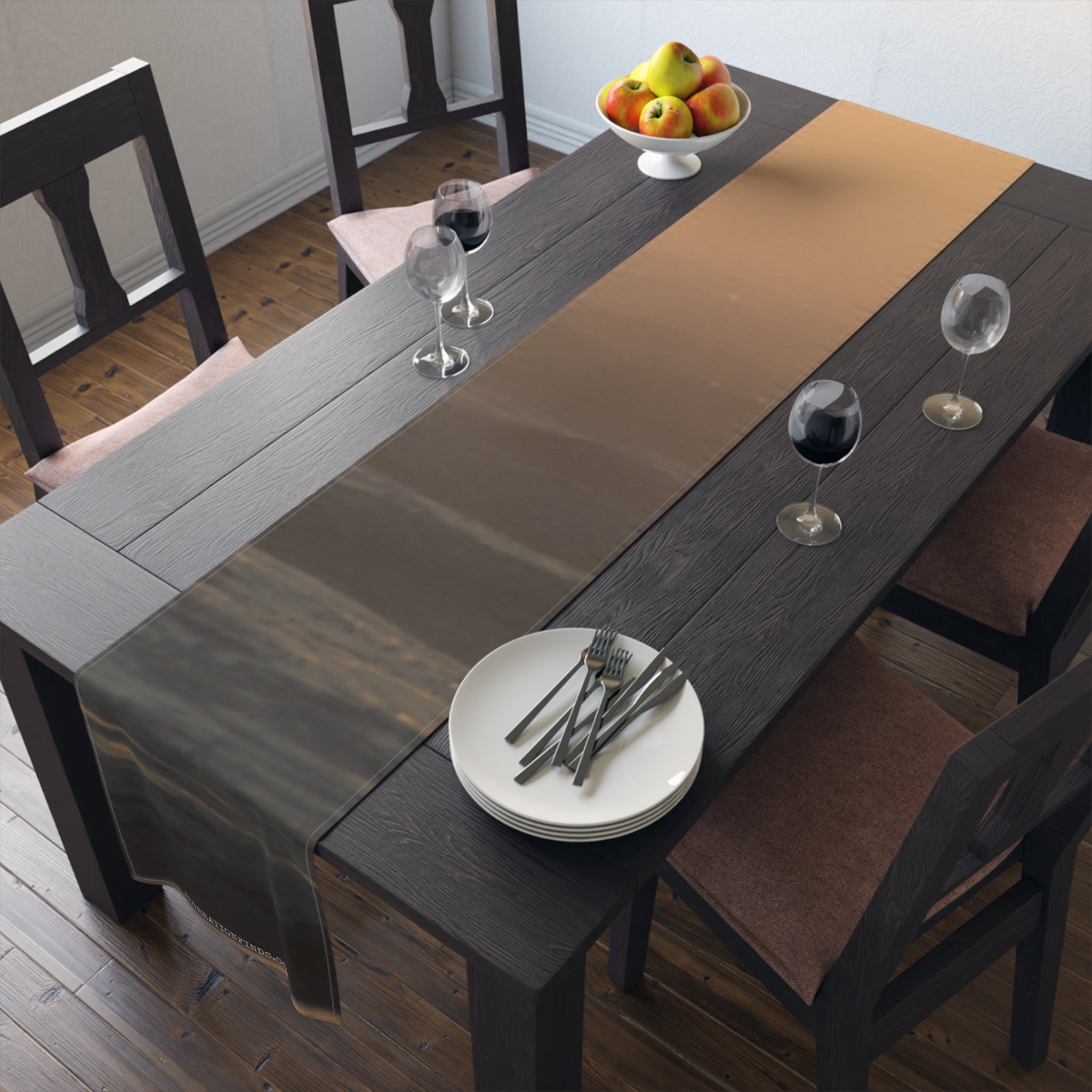 Dark wooden dining table with runner, plates, and wine glasses.