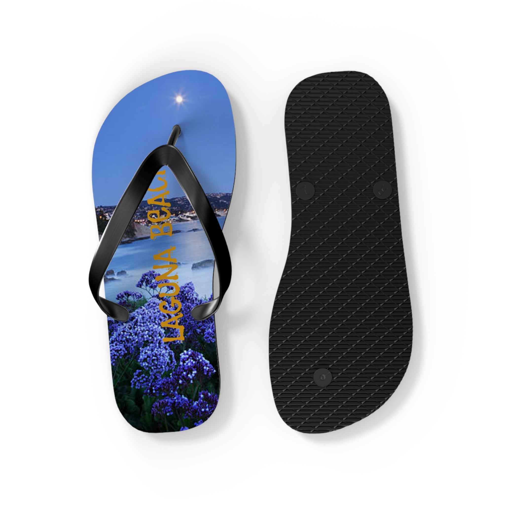 Flip-flops featuring a nighttime coastal view with "LAGUNA" in purple flowers.