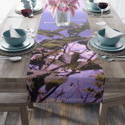 Table runner with purple lilies and green leaves pattern.
