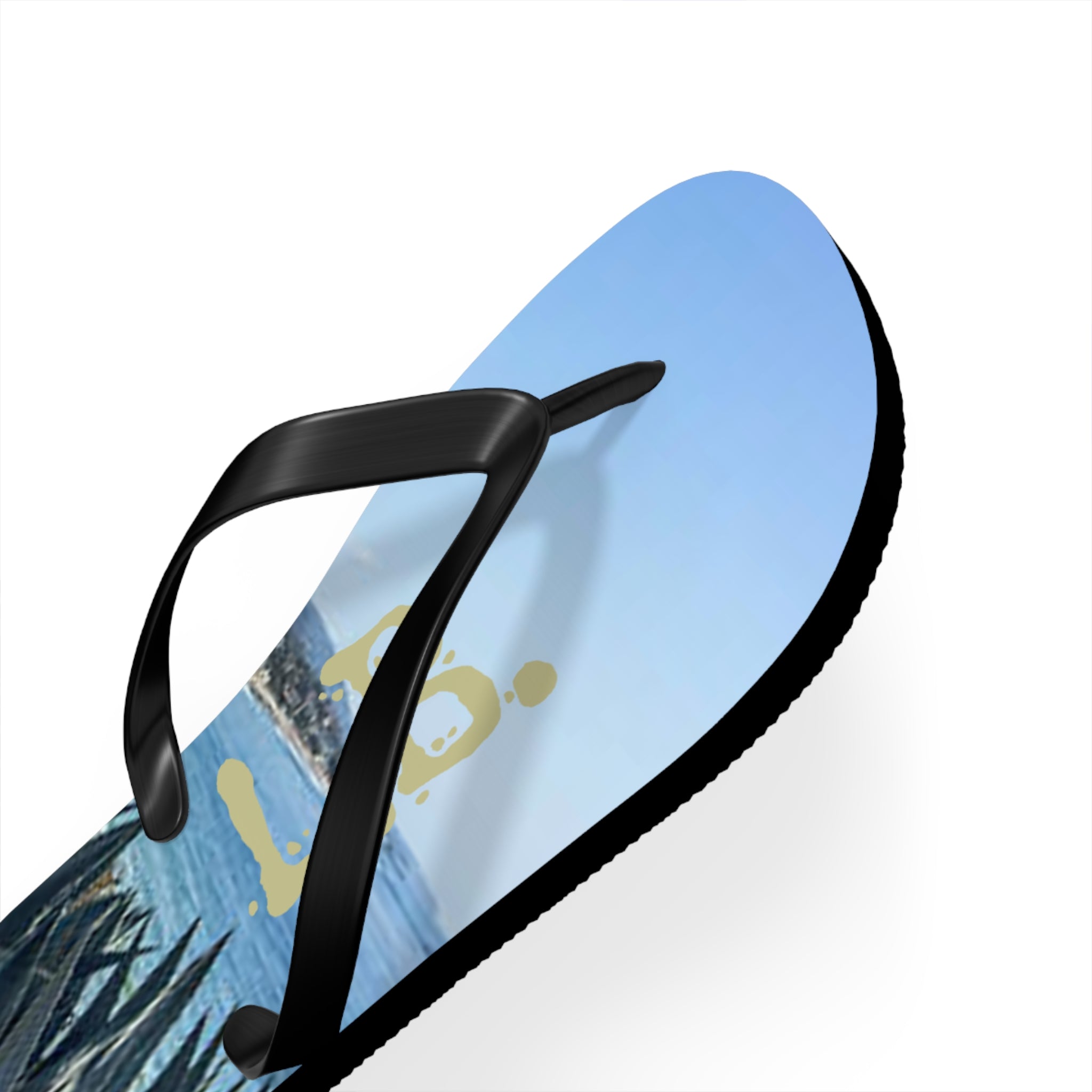 Black flip-flop with a beach scene and yellow "Aloha" text.