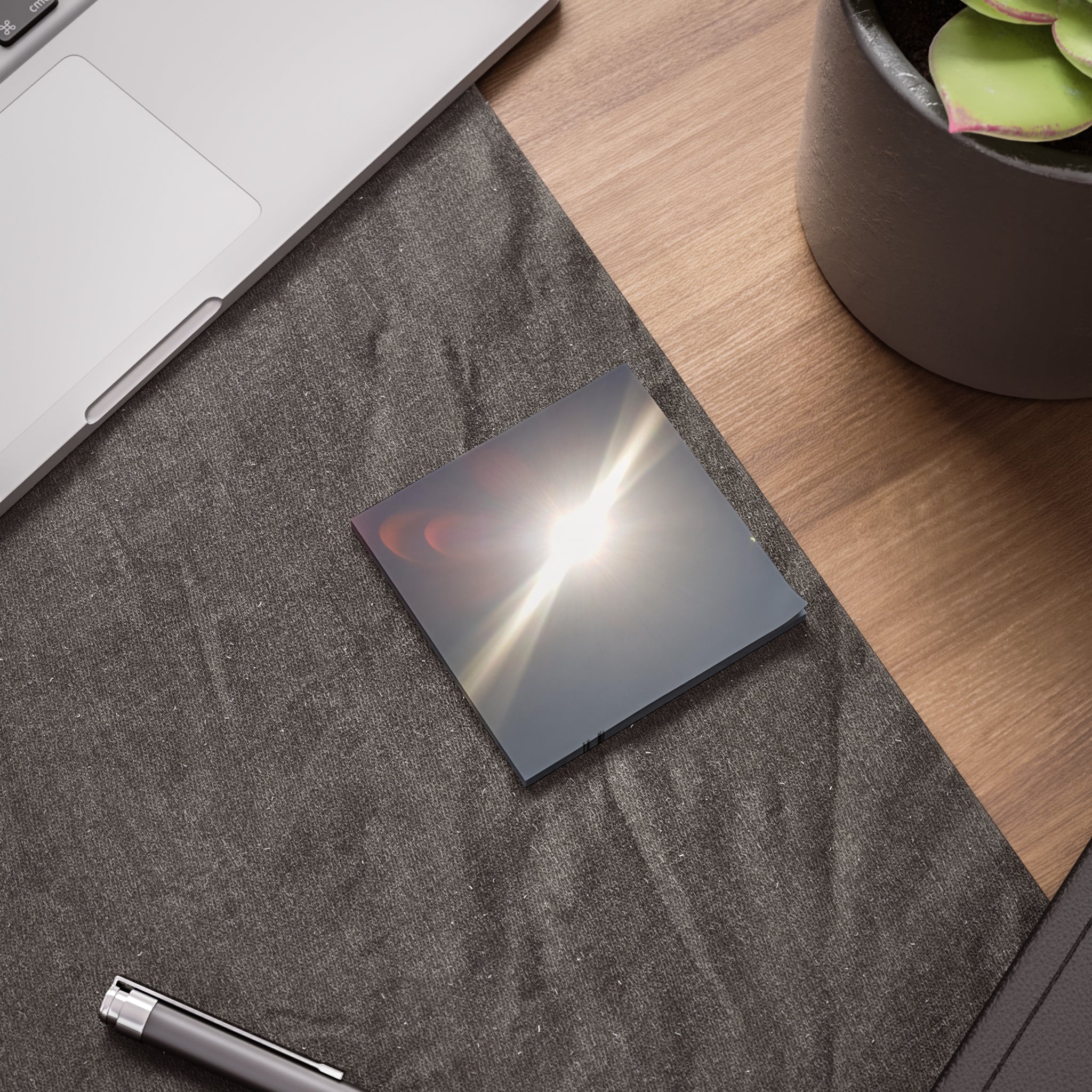 Post-it note featuring a lens flare effect of the sun.