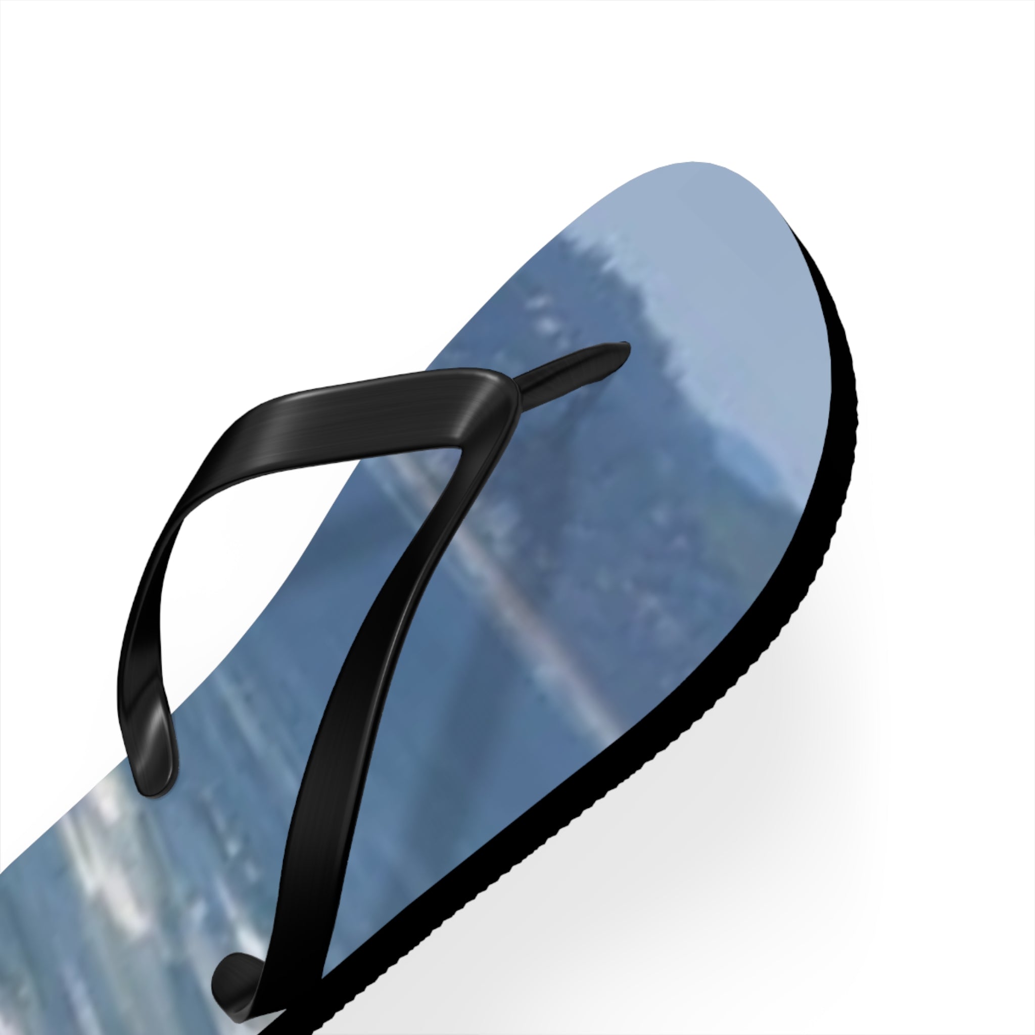 Black flip-flop with a scenic mountain landscape print.