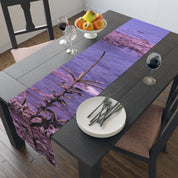Table runner with a purple sky and tree branch design.