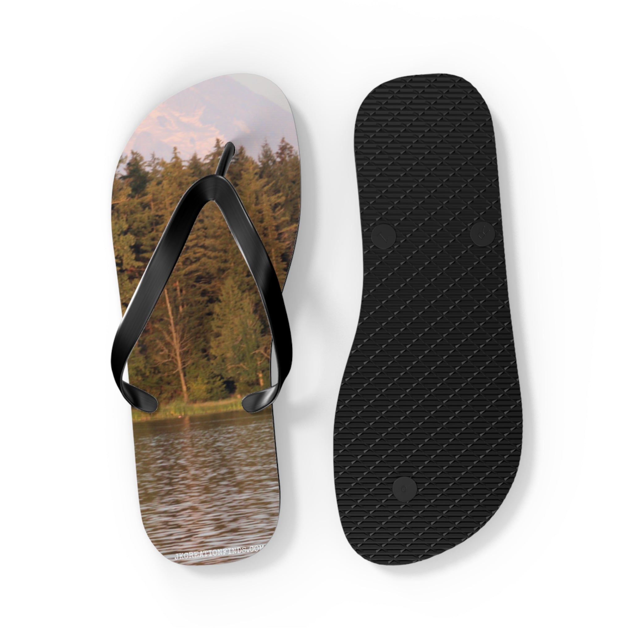 Flip-flops with a lake and forest scene on the left sandal.