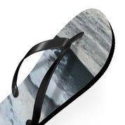 Black flip-flops with a grey and white marbled sole.