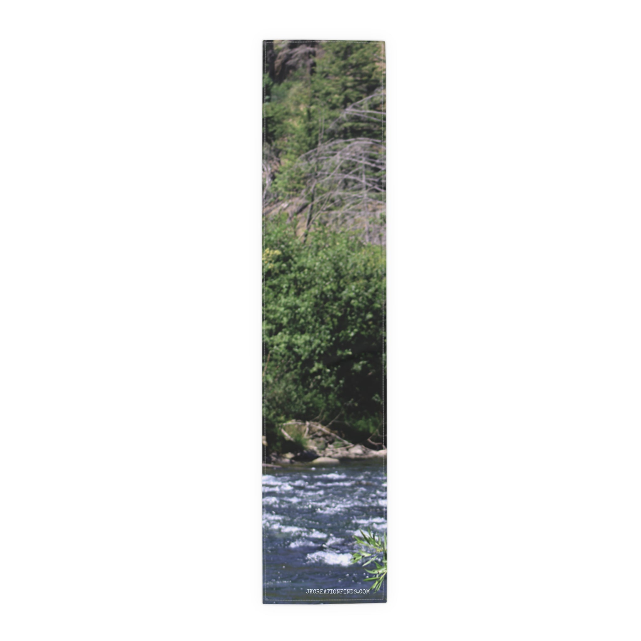Fabric banner with water, trees, and "JROSEATTIONFINDS.COM" text.