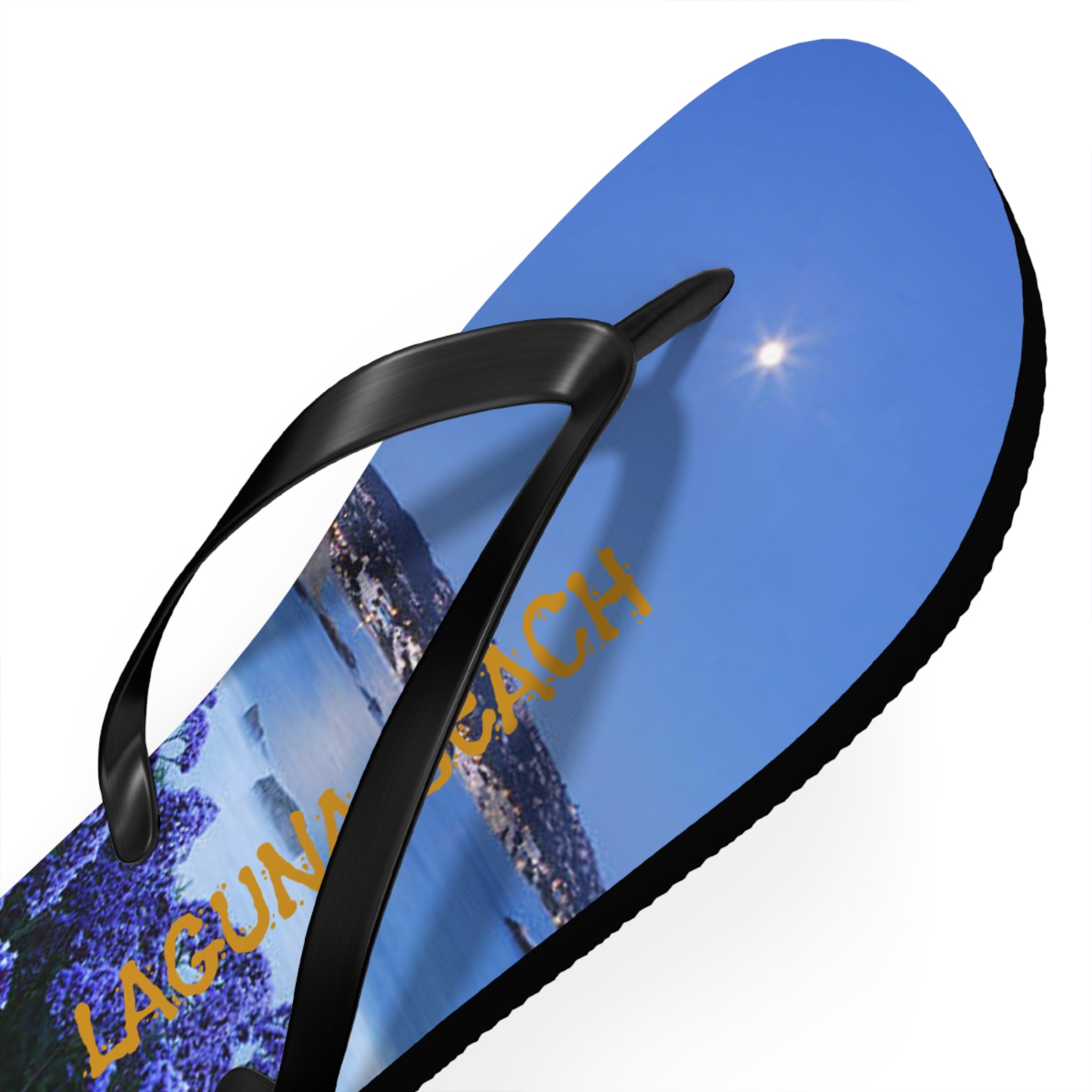 Flip-flop with "LAGUNA BEACH" text and a lavender field against a blue sky.
