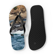 Flip-flops with a beach and ocean scene on the left sole.