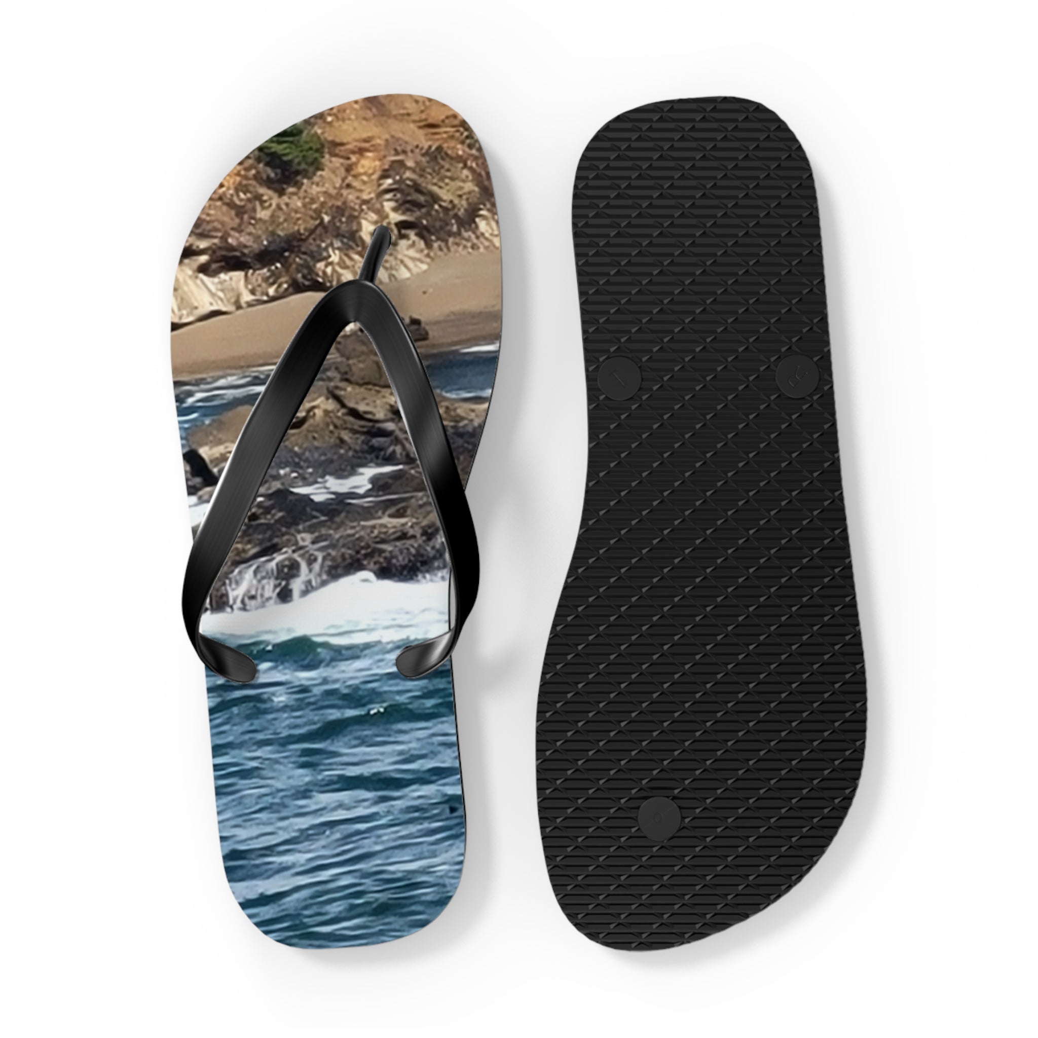 Flip-flops with a beach and ocean scene on the left sole.