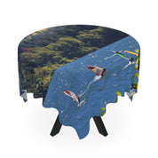 Tablecloth with windsurfers on a lake and forest scene.