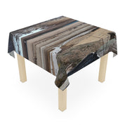Tablecloth with a landscape scene featuring water, snow, and rocks.