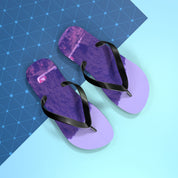 Purple flip-flops with black straps on a light blue background with a grid pattern.