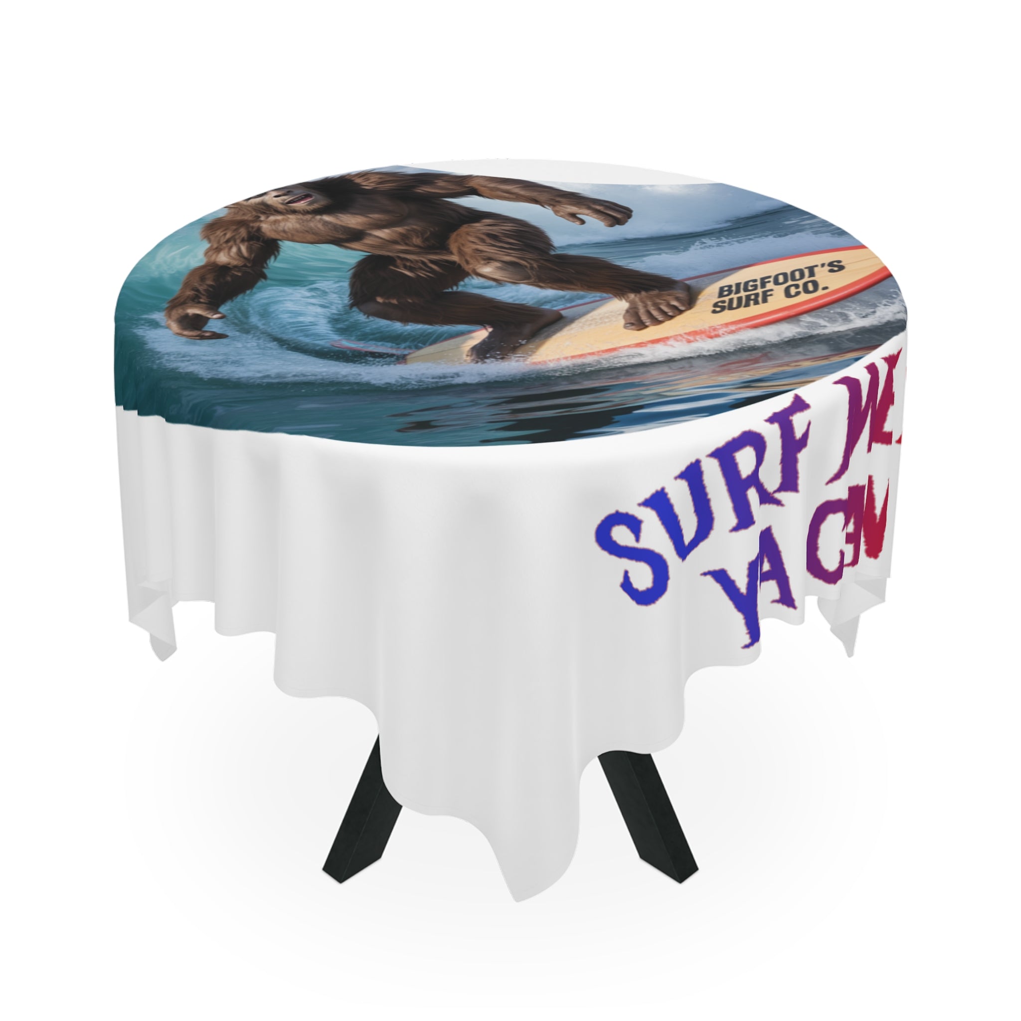 Tablecloth with Bigfoot surfing and "Bigfoot's Surf Co." and "Surf Ya Gnu" text.
