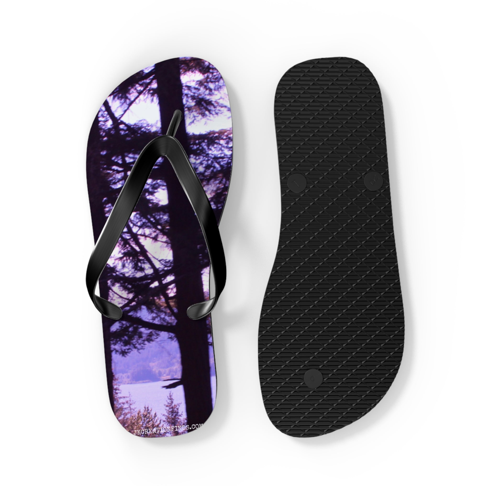 Flip-flops with a forest and lake scene on the footbeds.