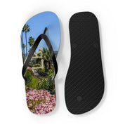 Flip-flops with a colorful floral and palm tree beach scene.