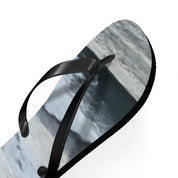 Black flip-flop with marbled grey and white sole.