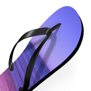 Black flip-flop with a beach sunset scene printed on the sole.