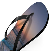 Flip-flops with a sunset beach scene on the footbed.