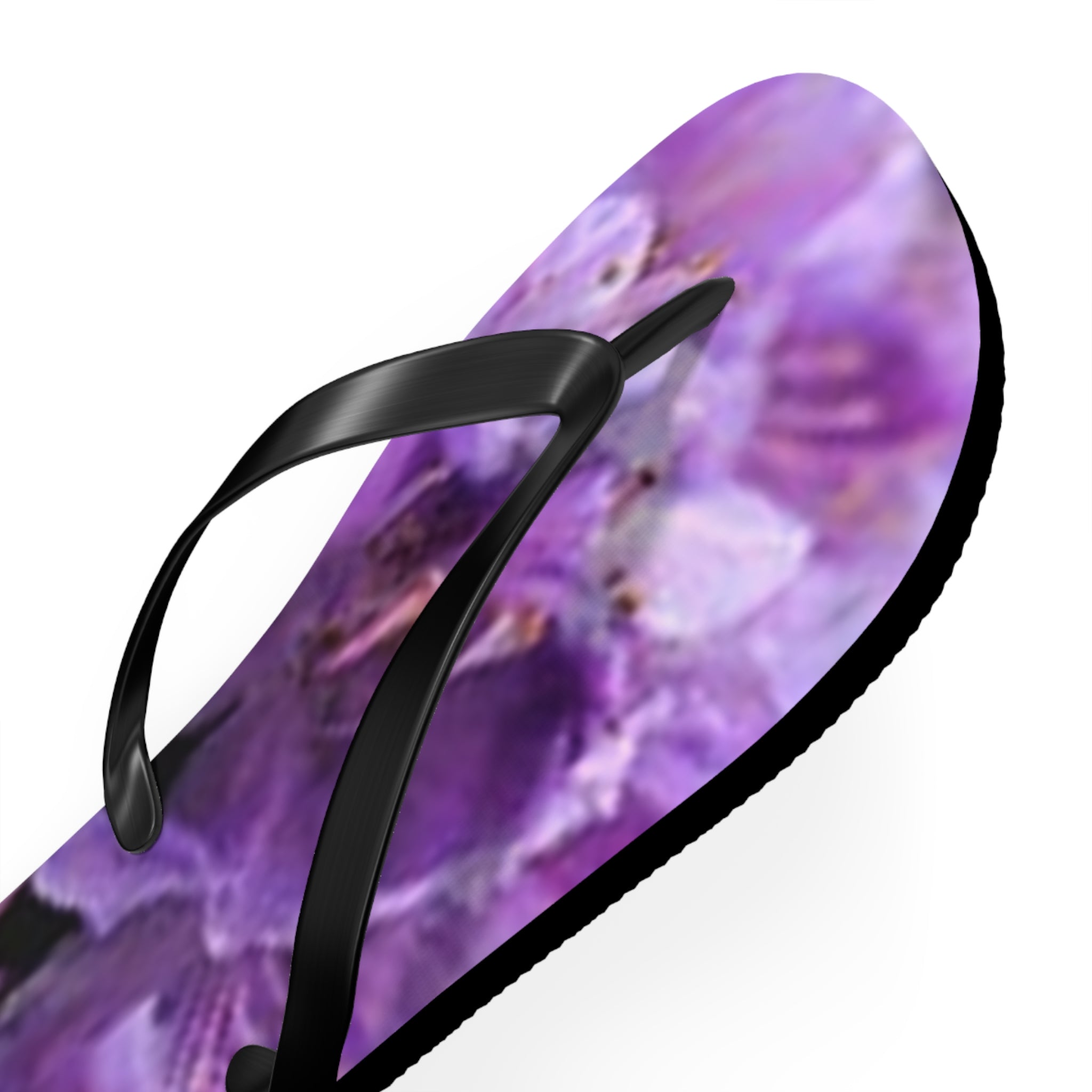 Black flip-flop with a purple floral pattern.