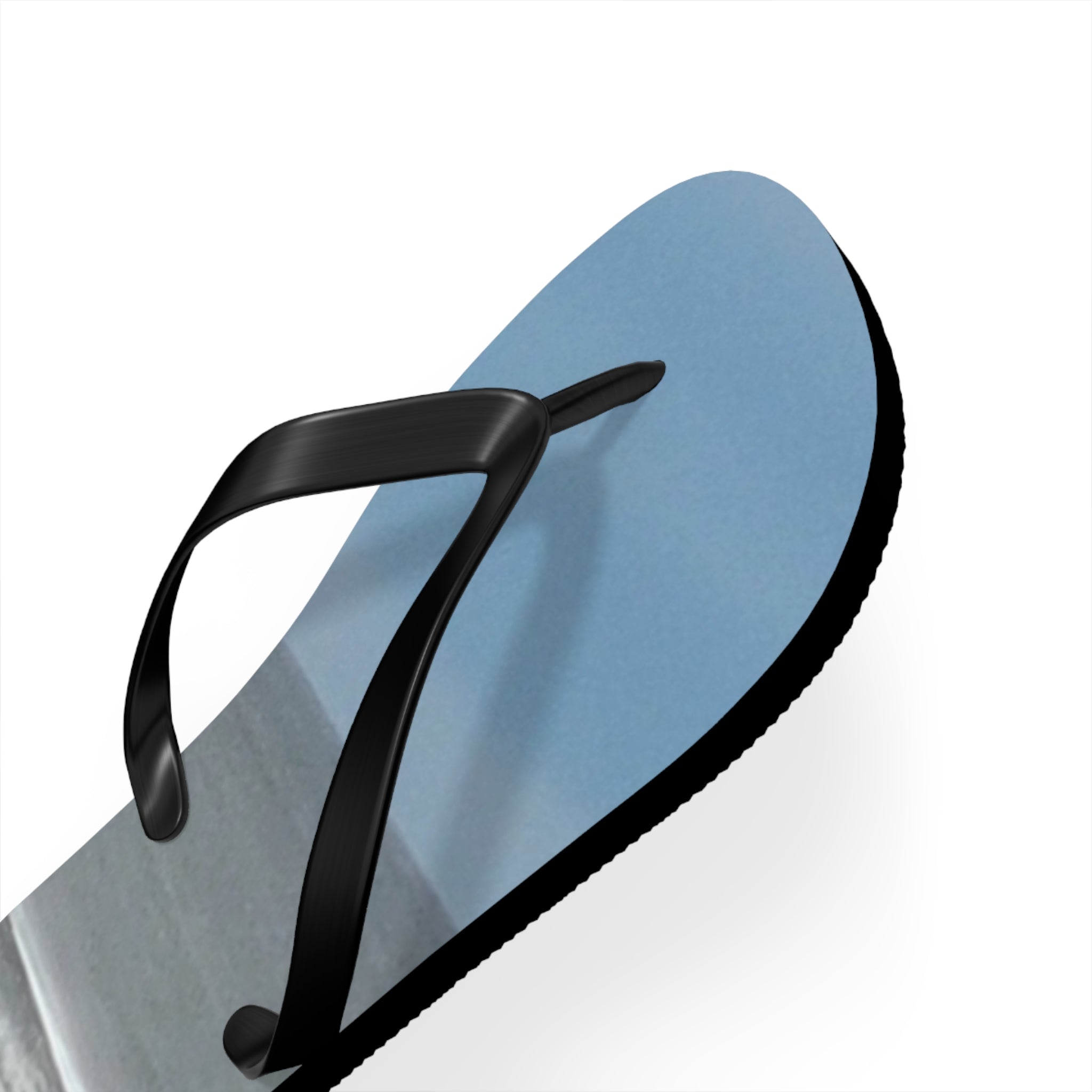 Blue flip-flop with black strap on a white background.