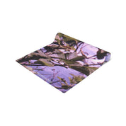 Rolled yoga mat with purple border and leaves design, "YOGIIONFINDS.COM" text.