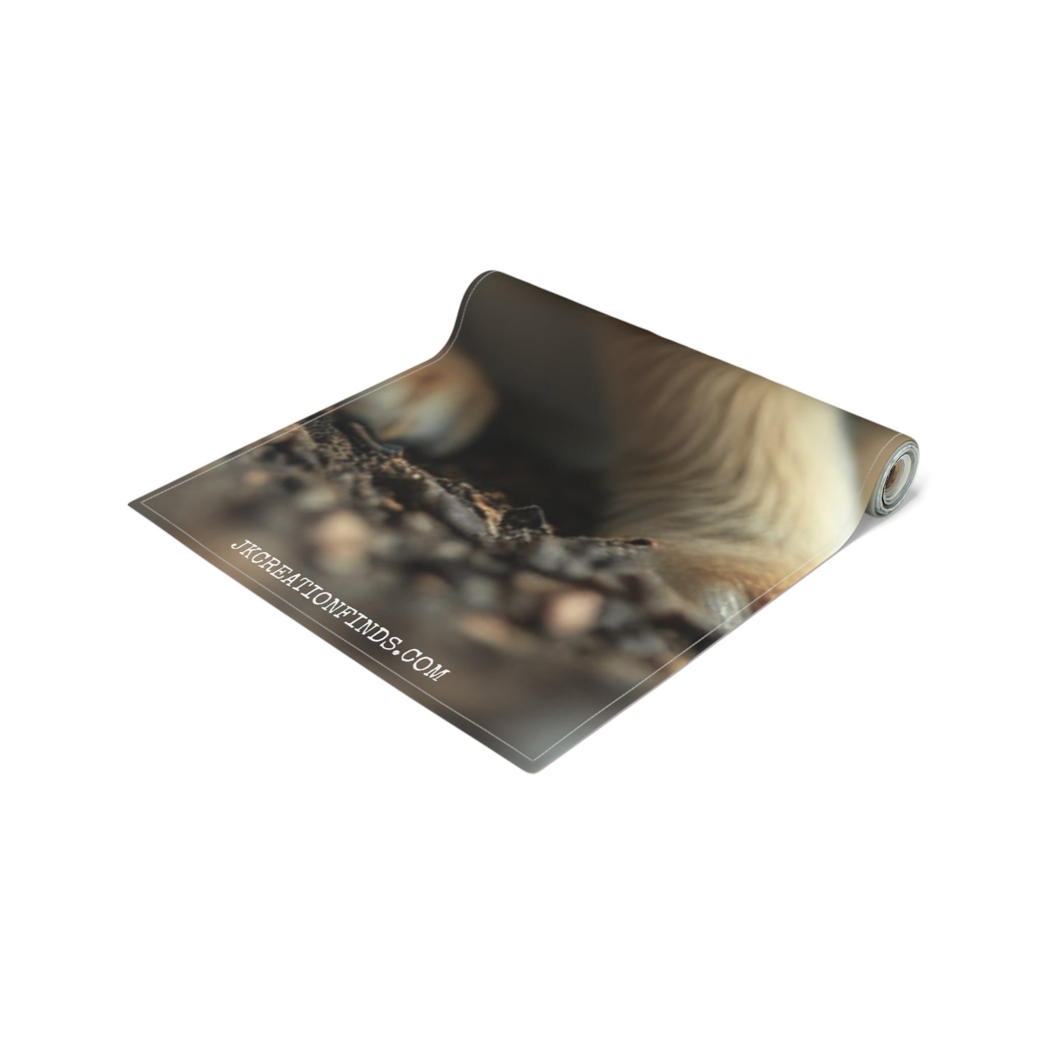 Rolled up yoga mat with Jkcreationfinds.com watermark on a white background.