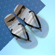 Flip-flops with a beach landscape on a blue geometric background.