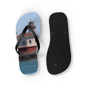 Flip-flops with a lighthouse on the left, textured sole on the right.