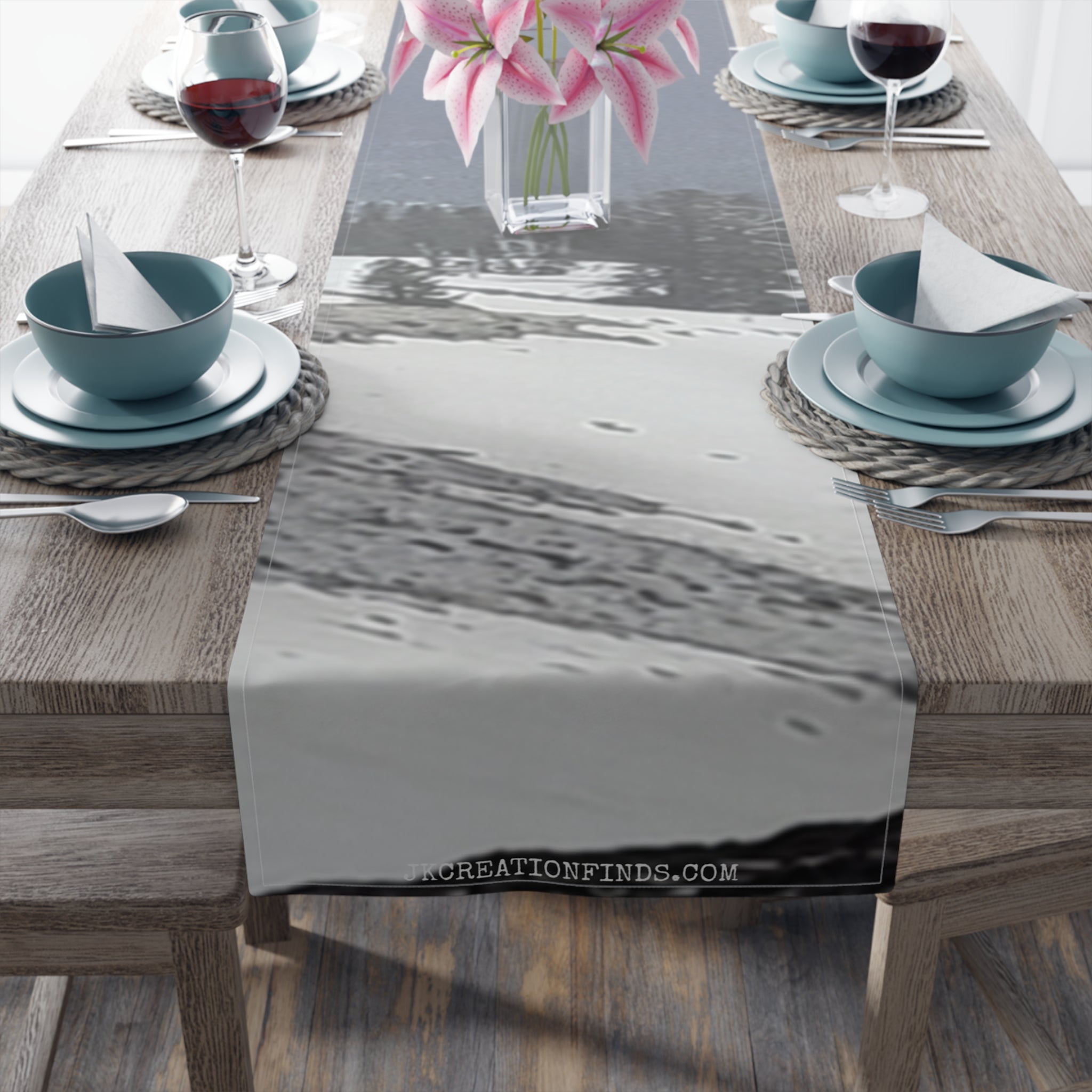 Table runner with abstract water pattern and "RECREATIONFINDS.COM" text.