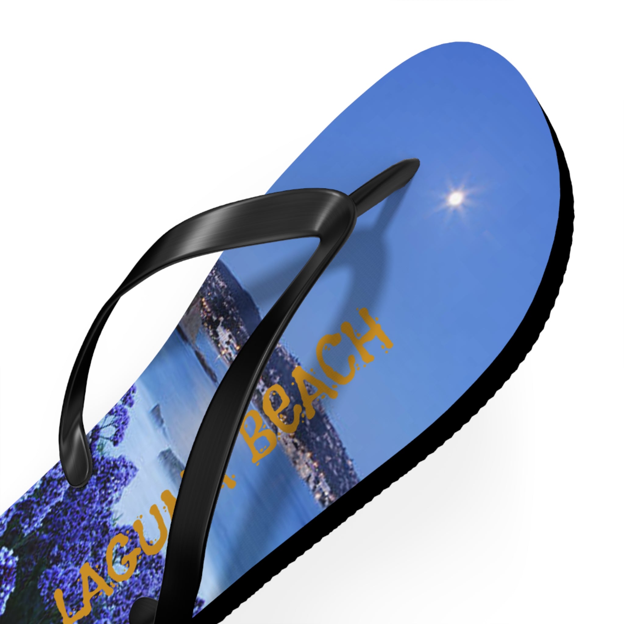 Flip-flops with a scenic beach and "Laguna Beach" text.