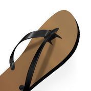 Brown flip-flop with black straps on a white background.