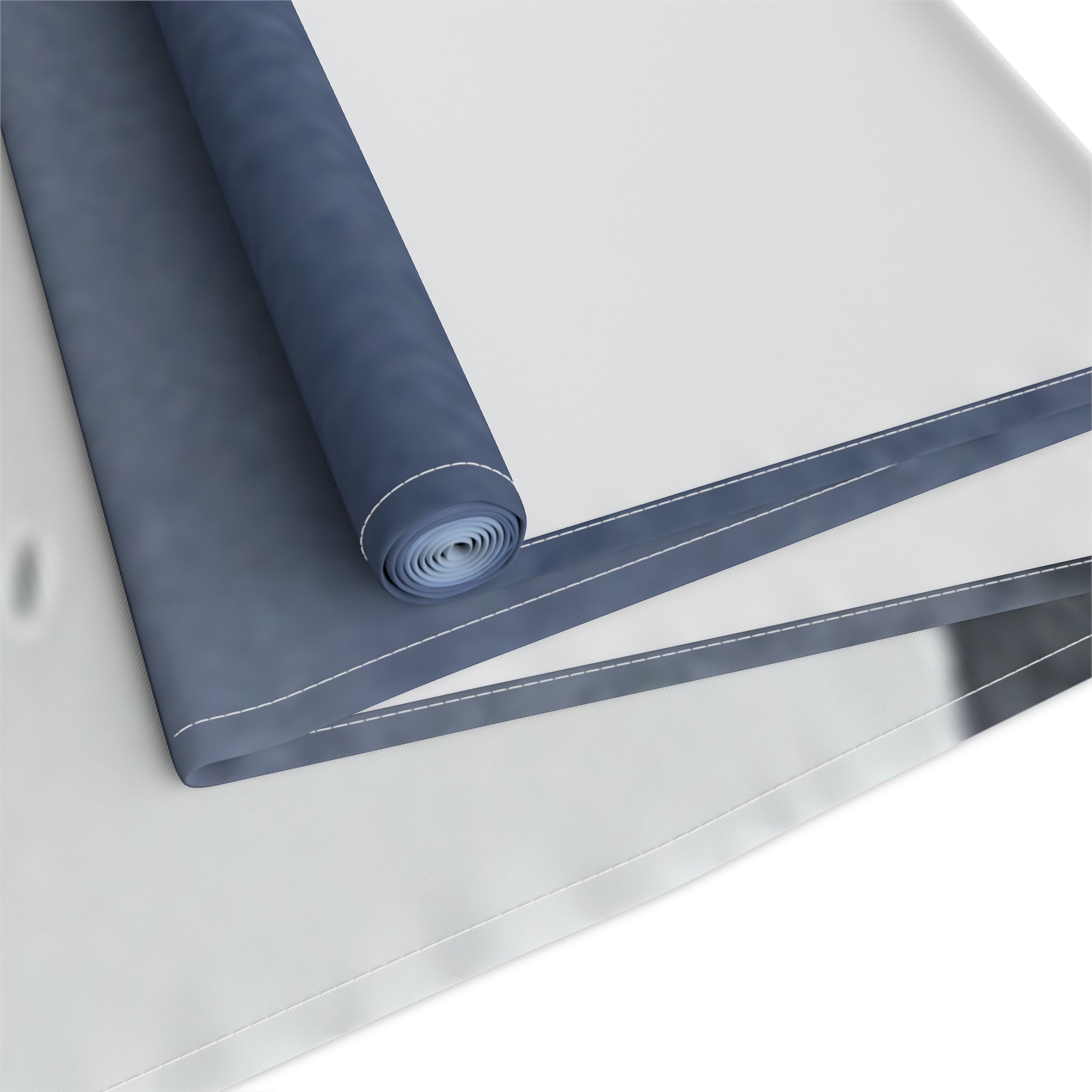 Rolled up blue tarp with white binding, ready for use.