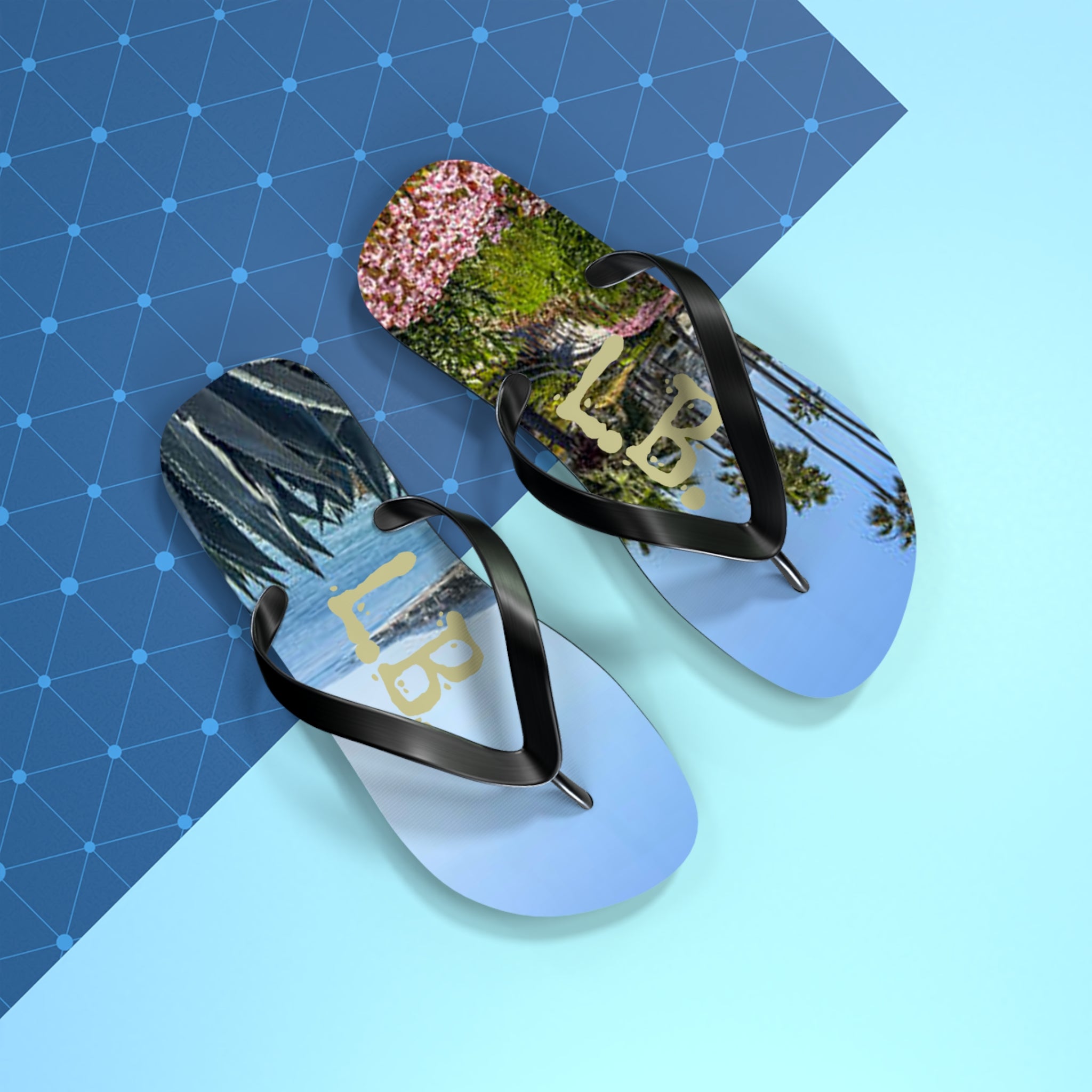 Flip-flops with beach and palm tree scenes, textured background.