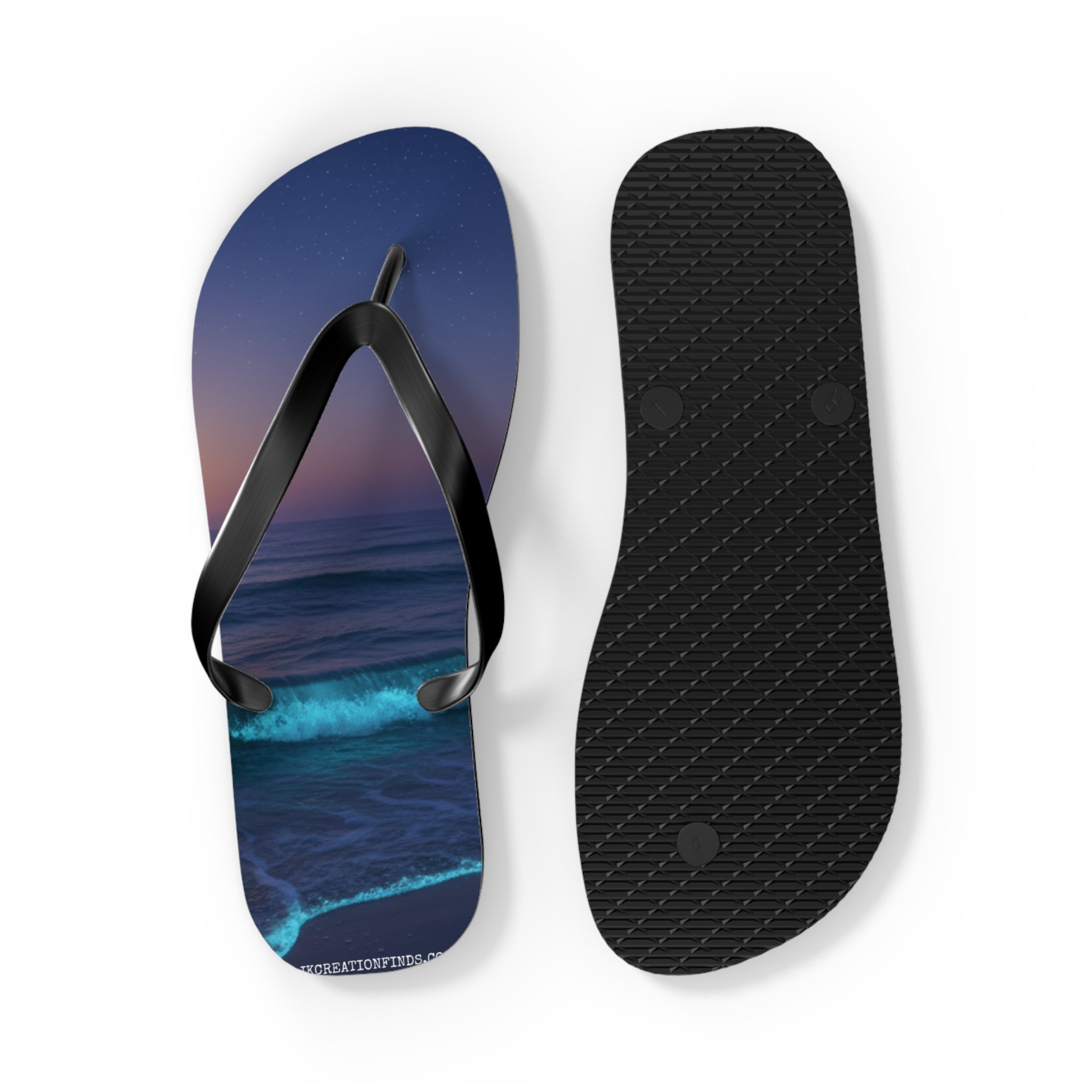Flip-flops with a starry night ocean wave design and black textured sole.