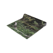 Rolled yoga mat with mossy forest pattern and "RECREATIONFINDS.COM" watermark.