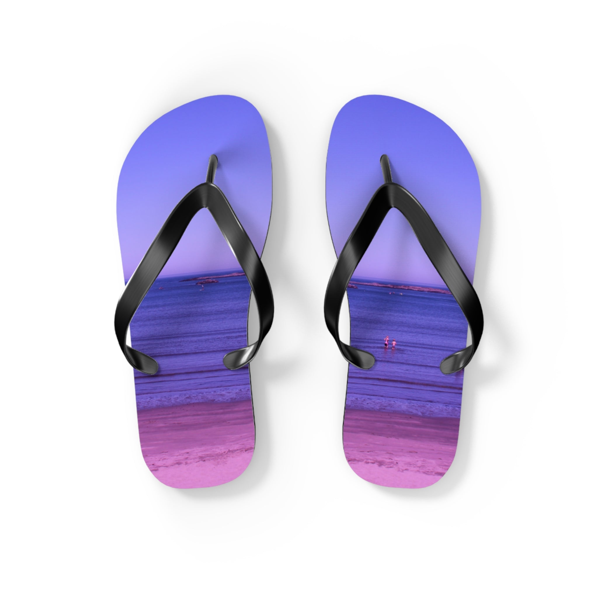 Flip-flops with a beach scene featuring people in the water.