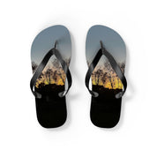 Flip-flops with a sunset over trees and buildings design.