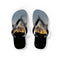 Flip-flops with a sunset over trees and buildings design.
