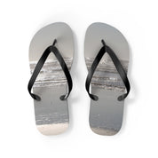 Flip-flops with a beach scene design, isolated on white.