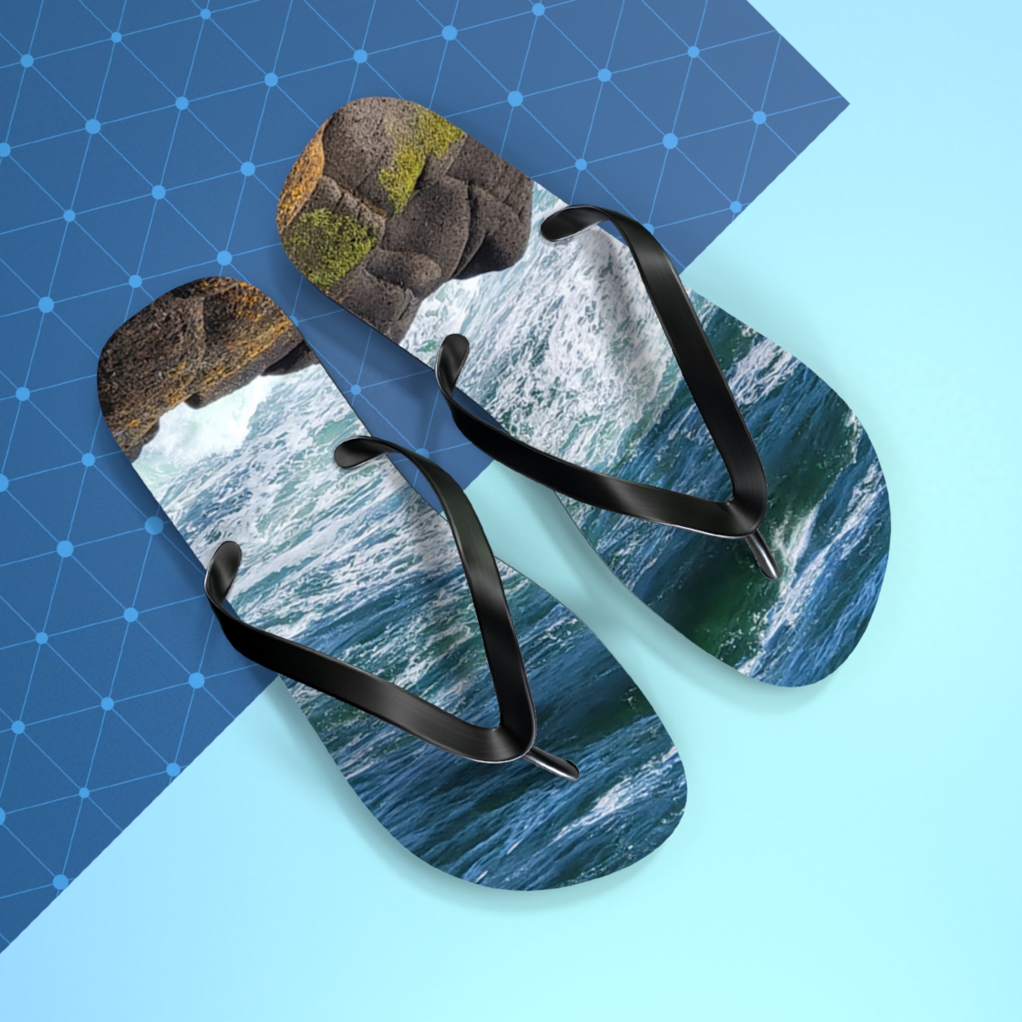 Flip flops with ocean waves and rocks on straps.