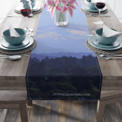 Blue misty mountain landscape on a fabric table runner.