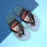Flip-flops with a lighthouse reflection on a blue grid background.