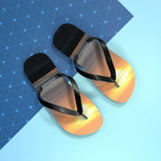 Flip-flops with a sunset design on a blue and light blue background.