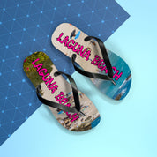 Black flip-flops with "LAGUNA BEACH" text on a beach scene.
