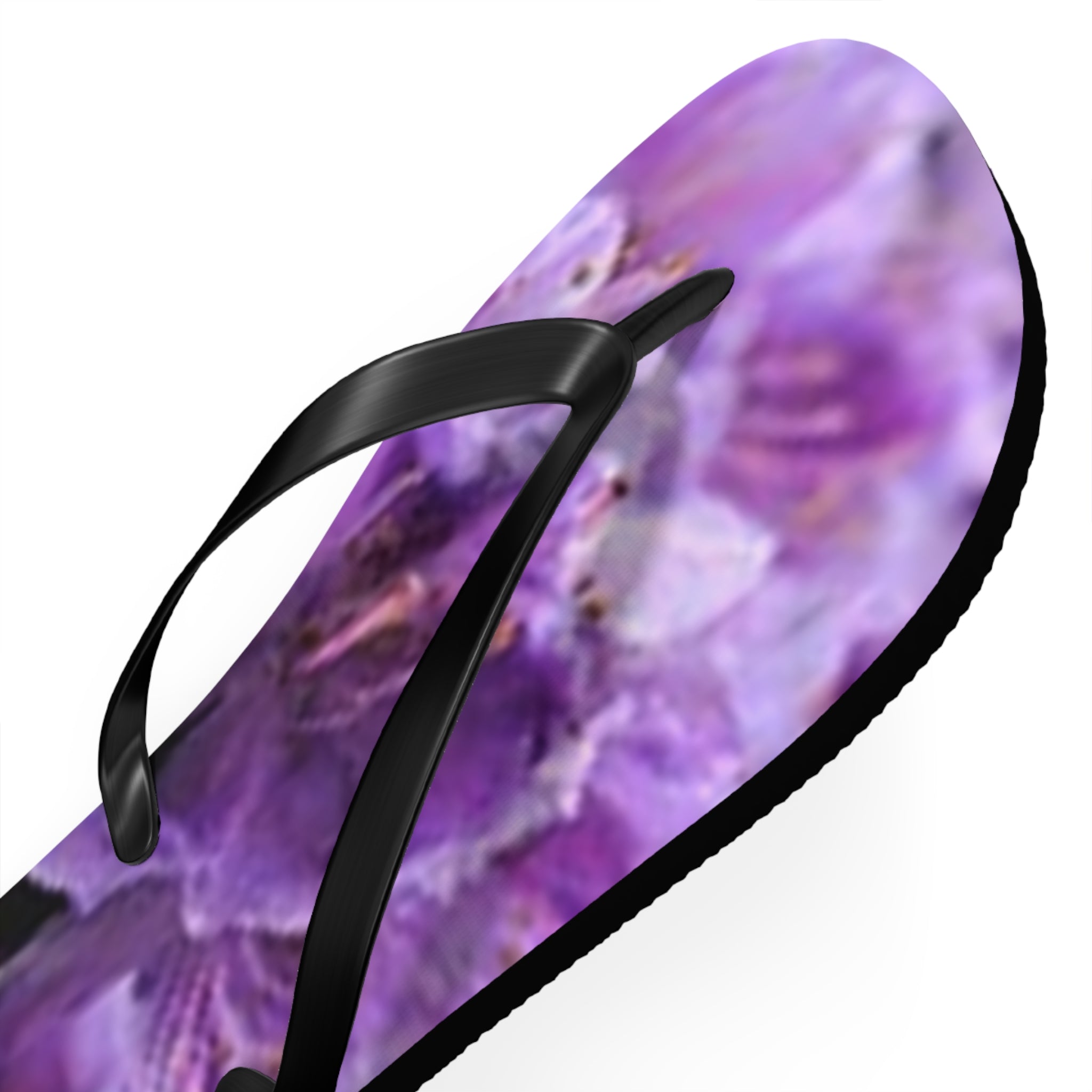 Purple floral flip-flop with black straps against a white background.