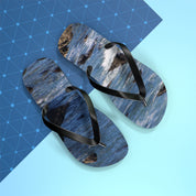 Flip-flops with a crashing wave pattern on a blue and geometric background.
