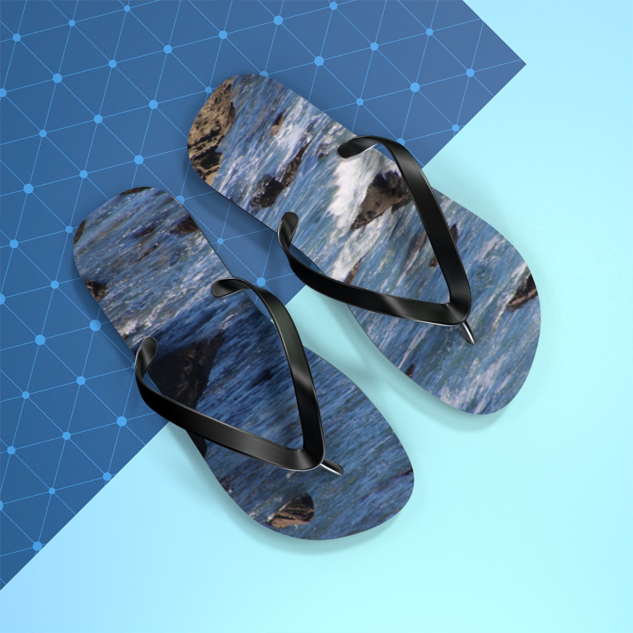 Flip-flops with a crashing wave pattern on a blue and geometric background.